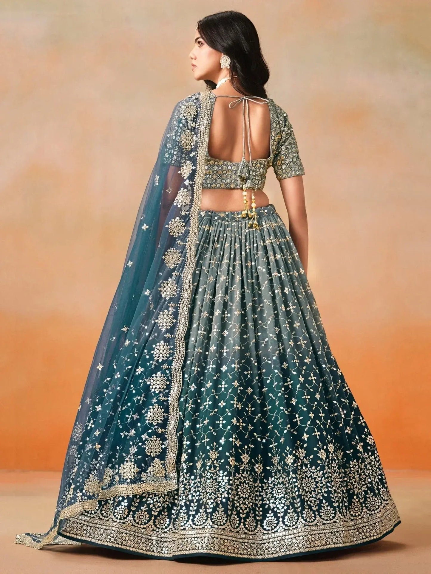 Glamorous Dove Blue Sequins Embroidered Georgette Lehenga Choli