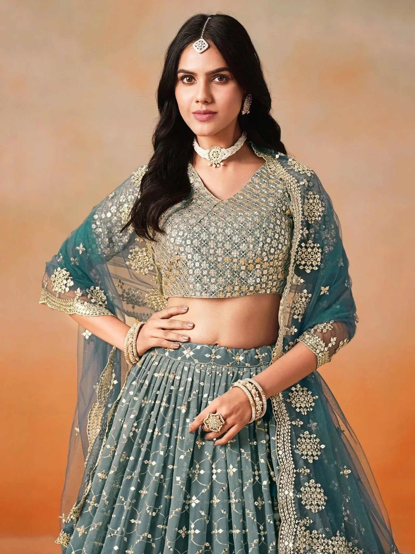 Glamorous Dove Blue Sequins Embroidered Georgette Lehenga Choli