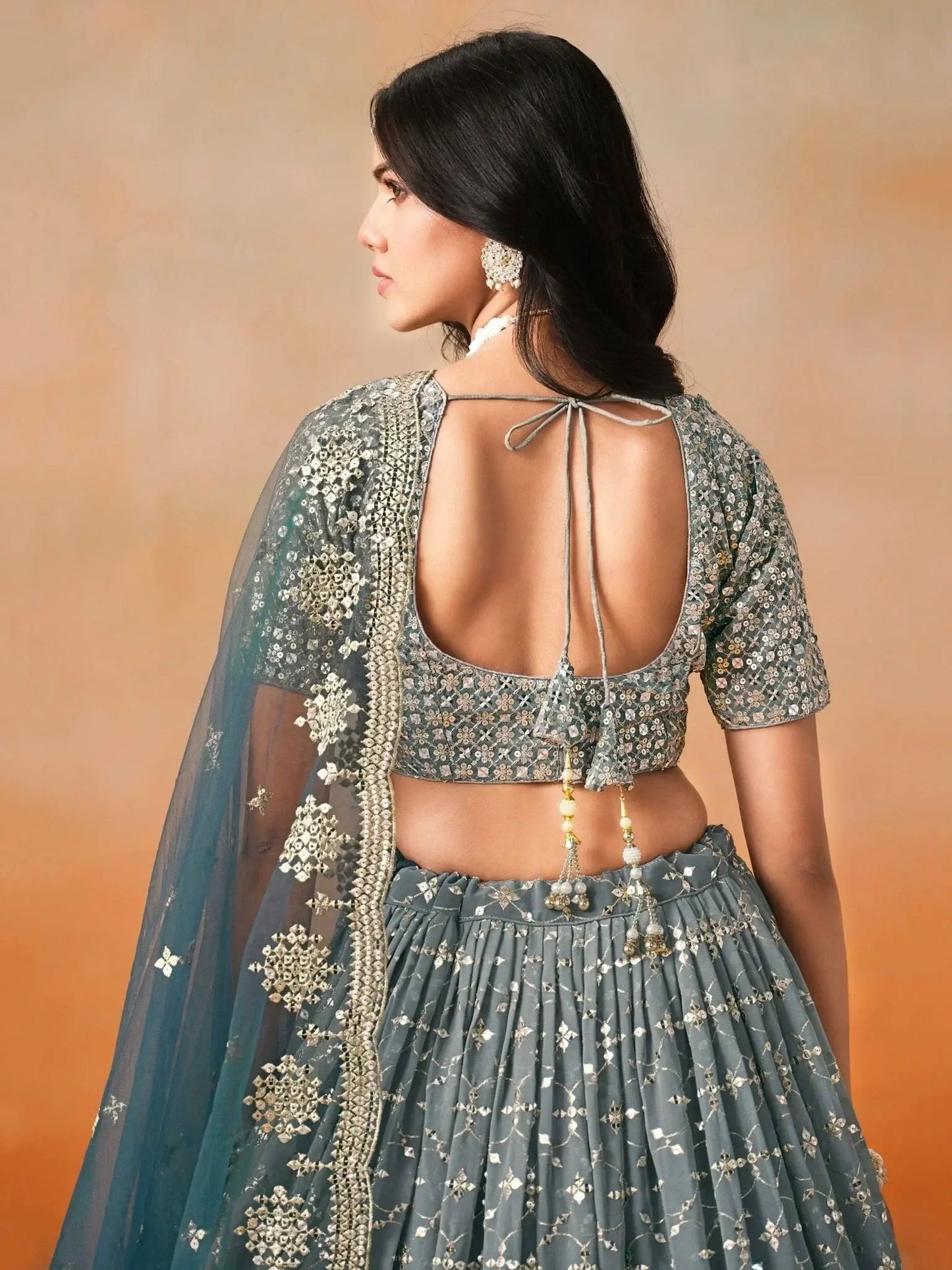 Glamorous Dove Blue Sequins Embroidered Georgette Lehenga Choli